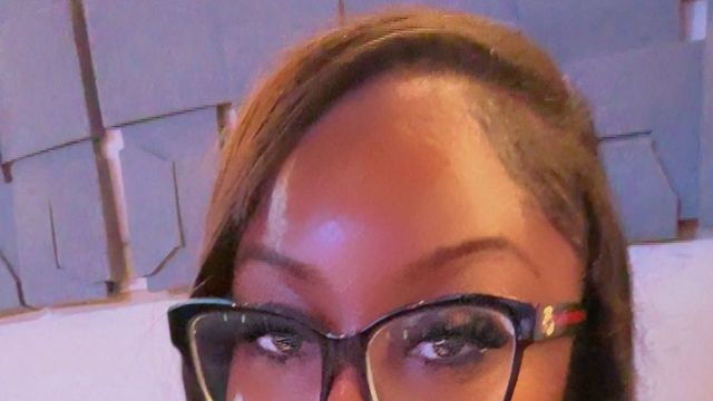 Stylist at Molly’s House of Beauty wearing a sleek straight install