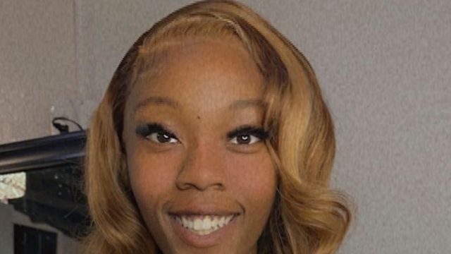 Stylist at Molly’s House of Beauty wearing a honey-blonde body-wave install